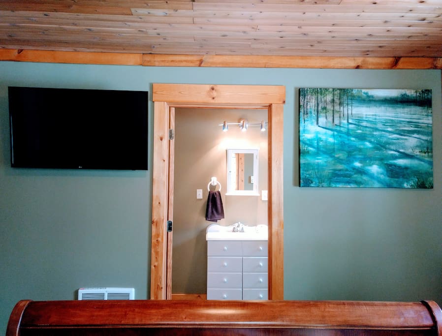 Entrance to bathroom as seen from Queen bed.