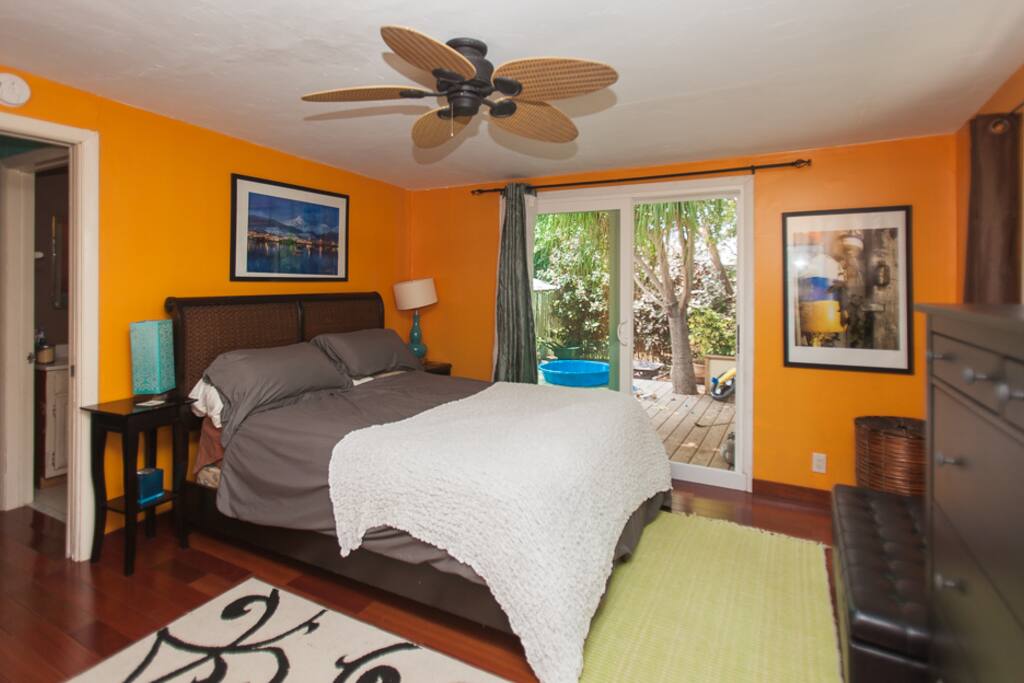Master Bedroom with a huge sliding glass doors to the deck and the garden