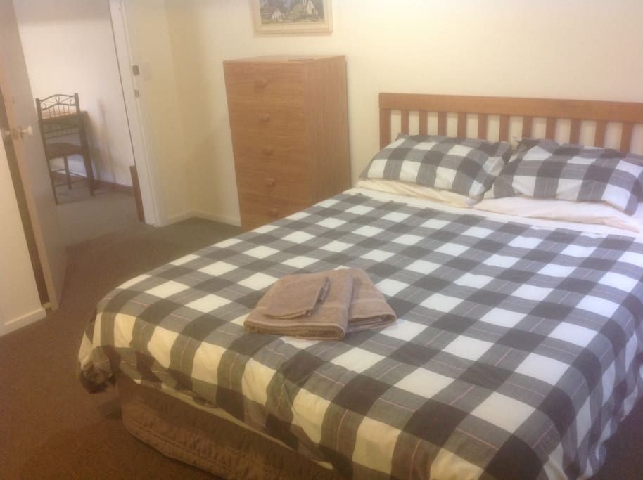 Separate bedroom with one queen bed