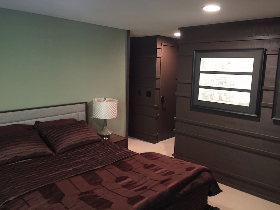 Original Frank Lloyd Wright Students designs on the wall. Super comfy bed with memory foam topper and 600 thread count sheets.