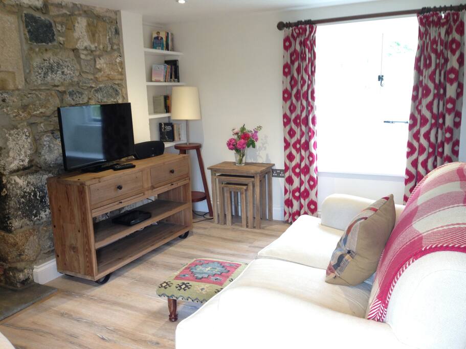 Comfortable sitting room with wood-burning stove