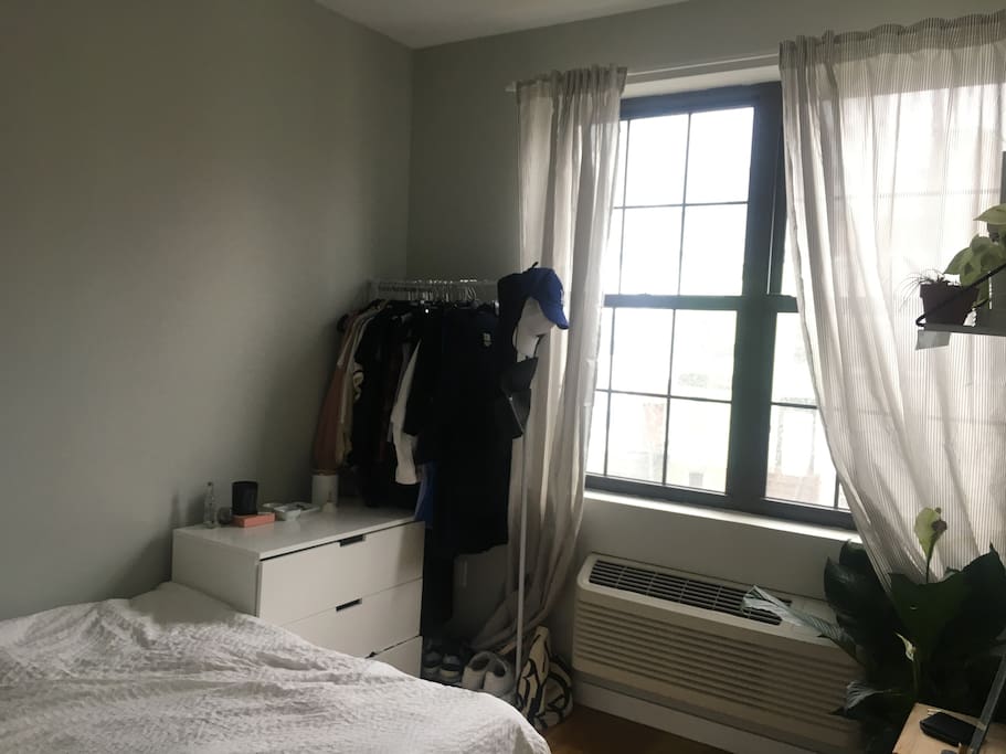 cozy room with lots of natural light. AC/heater in the room w/a built in fan.