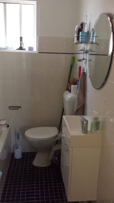 Tidy bathroom with separate shower and bath.