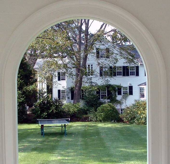 View of house from gazebo- ping pong table