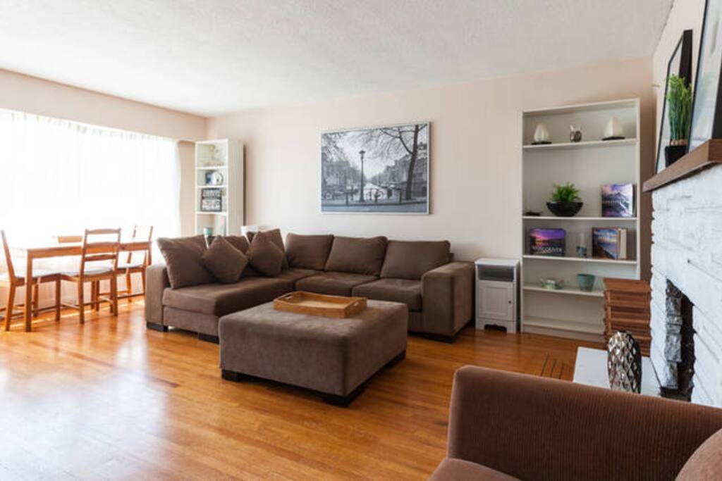 Living room with hardwood floor and large south facing window