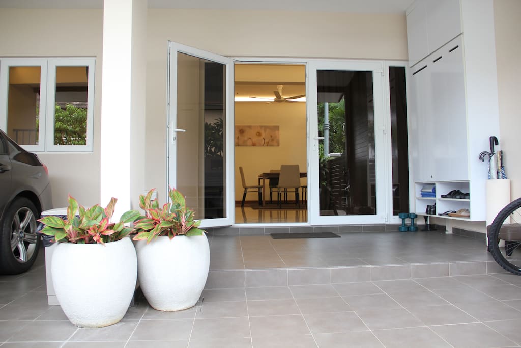 Front yard - Entrance to the house. The doors and windows are made with tinted glass and are soundproof, leaving no gap when they are shut completely. Good if you're playing music in the night - you wouldn't disturb the Neighbours.