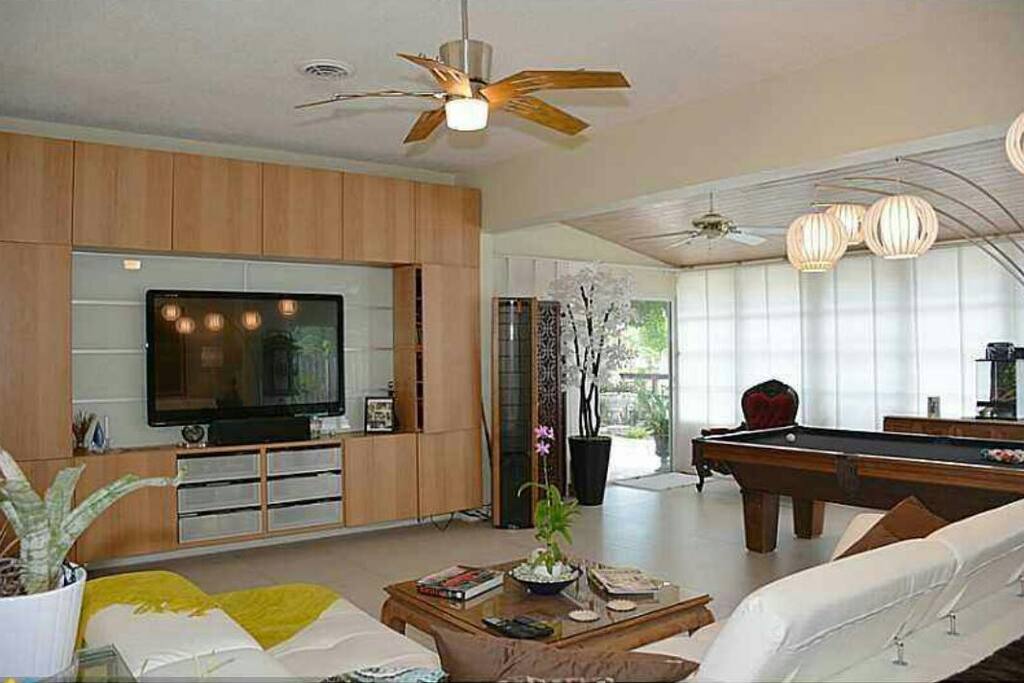 Main living room with high volume ceilings..Full high end A/V Surround Sound System & regulation 3/4 slate pool table. Very open and enjoyable feel..
