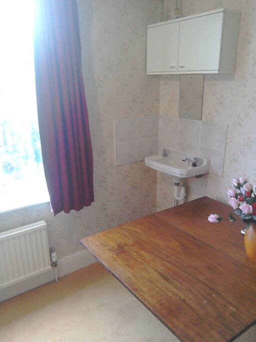 Private washbasin but a family bathroom next door.