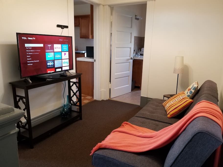 Living room with brand new 40" TV, Roku equipped! Kitchen and bathroom off this space makes gatherings easy!