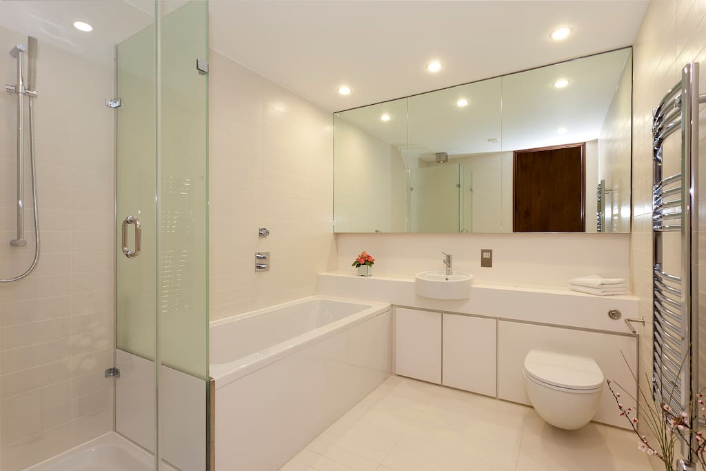 Spotless Bathroom with designer toiletries and power shower
