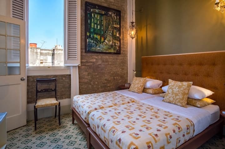 Room 1 with 2 personal beds but can be converted into a queen bed.