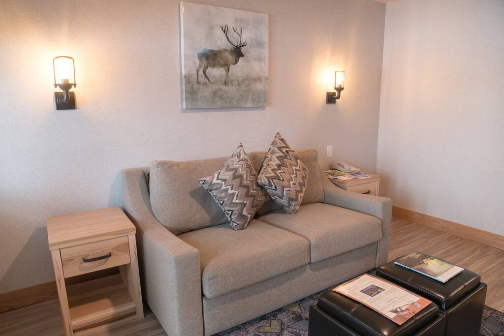 Sink into the cozy sofa after a day exploring the area.