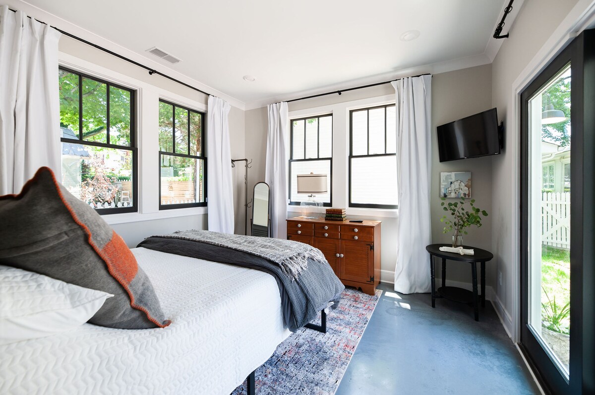 Queen bedroom in the back of the house with sliding doors out to the private patio. 
