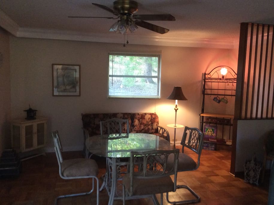 A very large sunny family room. Room enough for a group, enjoy a movie, play some cards and games, or step outside onto the patio for a little relaxation.