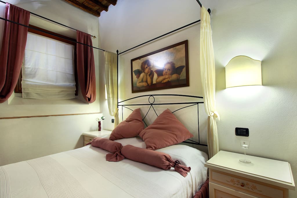 Double Bedroom with Air Conditioner, windows, Armchair, Original Tuscan wooden ceiling.