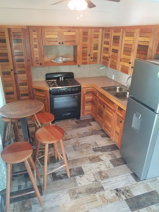 Beautiful kitchen with handmade Belizian wood cabinets
