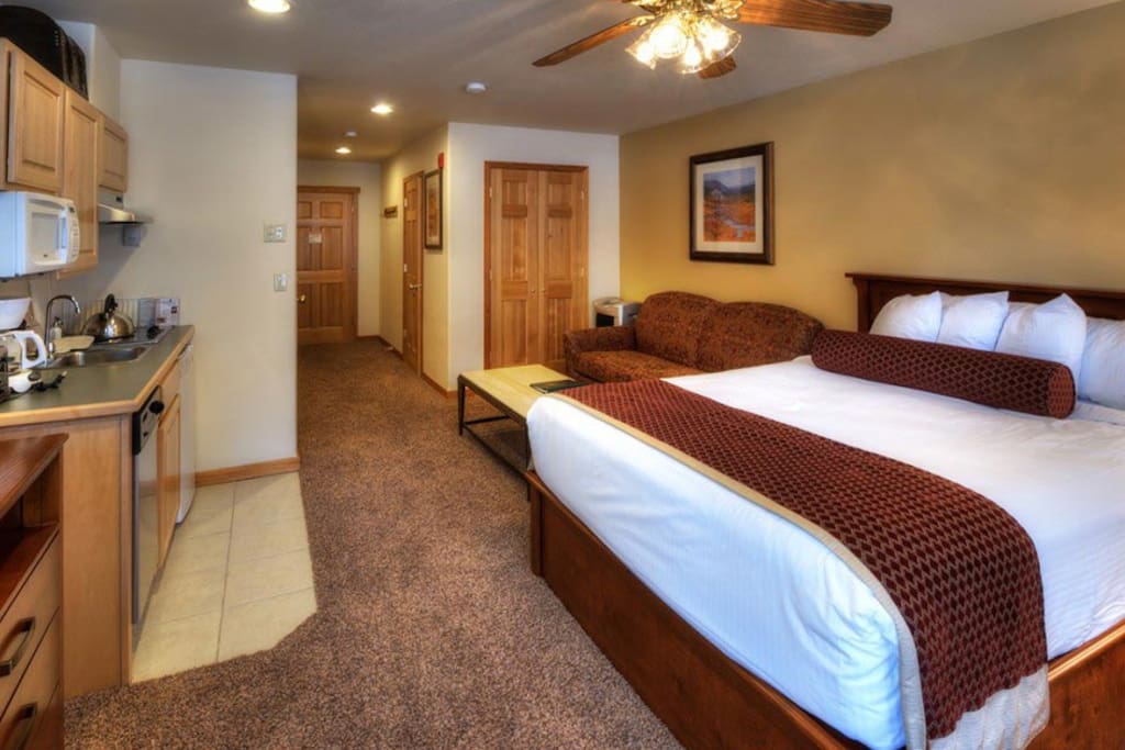 Studio Living Area with Queen Bed and Queen Sleeper Sofa