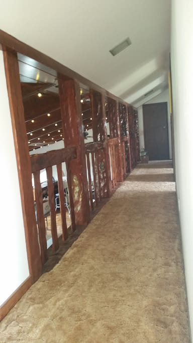 Top floor hall way looks down into 'Rec' room