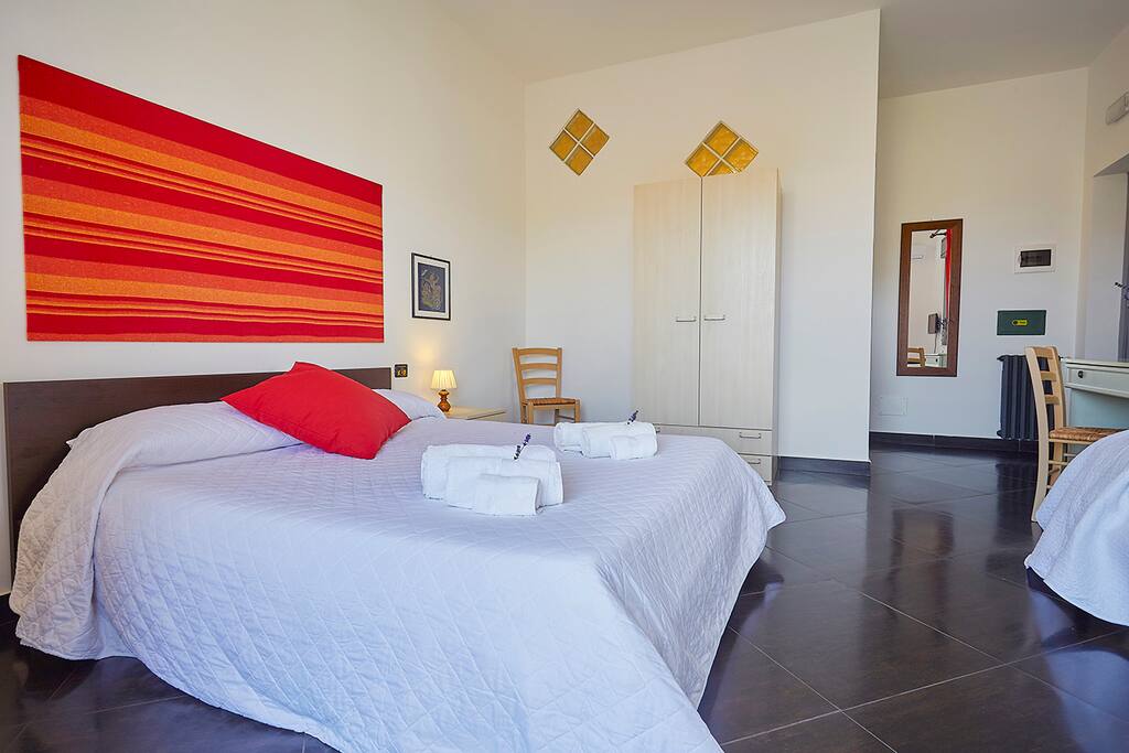 1^ Room: Double bed and a single bed (triple) with balcony