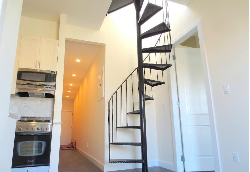 In-suite access to roof deck from spiral staircase