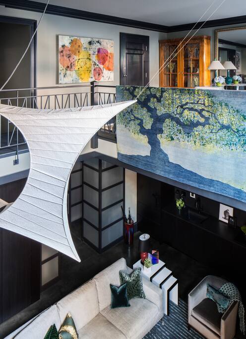 Lighting sculpture over the double height space in living room