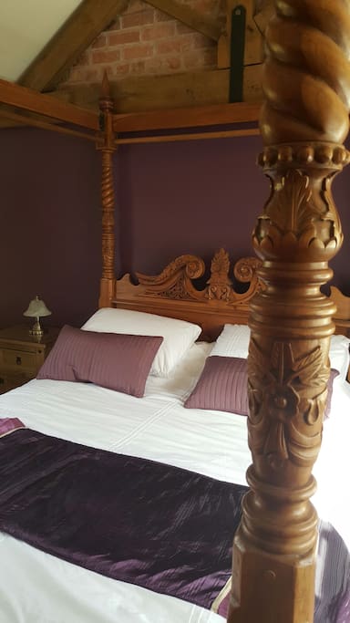 Romantic four poster king size bed with luxury Laura Ashley mattress. Room for a travel cot that can be supplied.