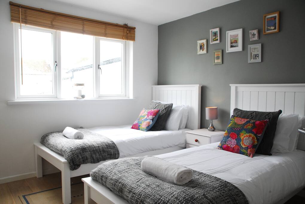 Stylish twin bedroom with memory foam mattresses.
