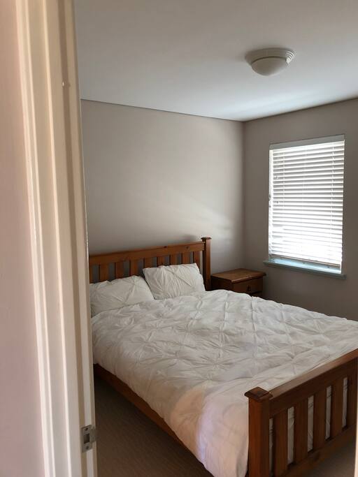 Large spacious bedroom with queen bed wardrobe and ensuite