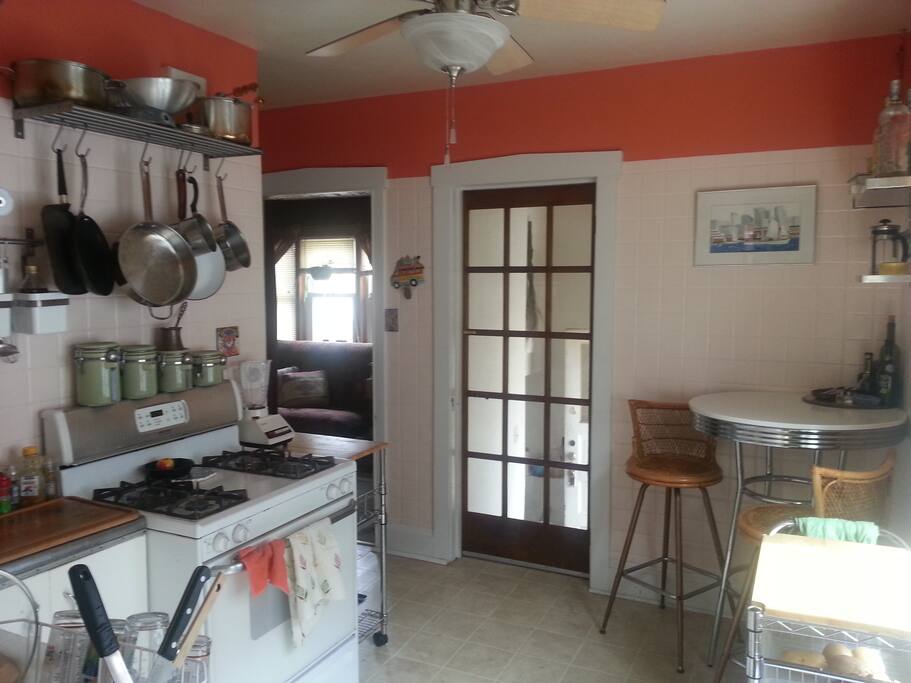 Full kitchen that has a coffee maker, microwave, and other essential amenities.