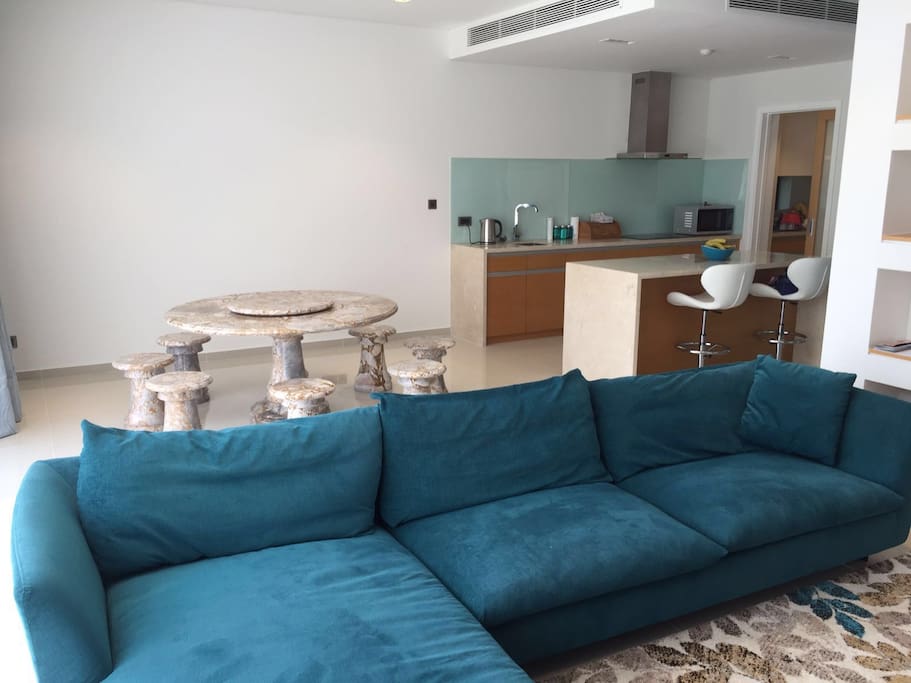 Spacious contemporary lounge and dining area. Feature marble dining table seats 8 for fun, family times together.