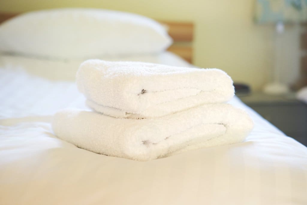 Fluffy towels and fresh white linens included