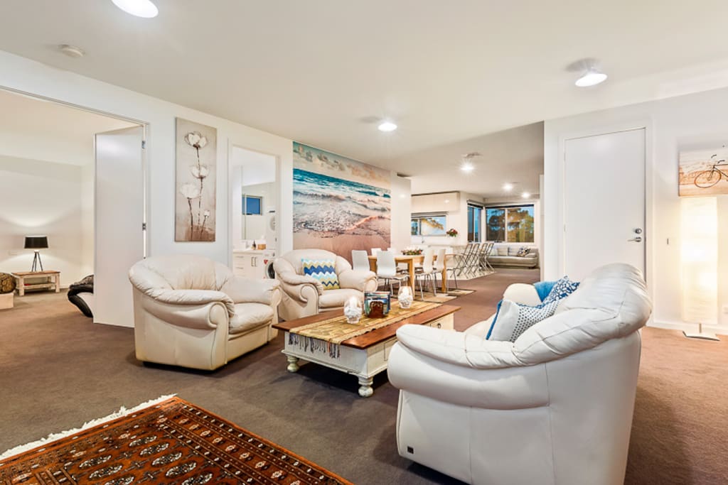 Front living area with glimpses of the dining space and beyond