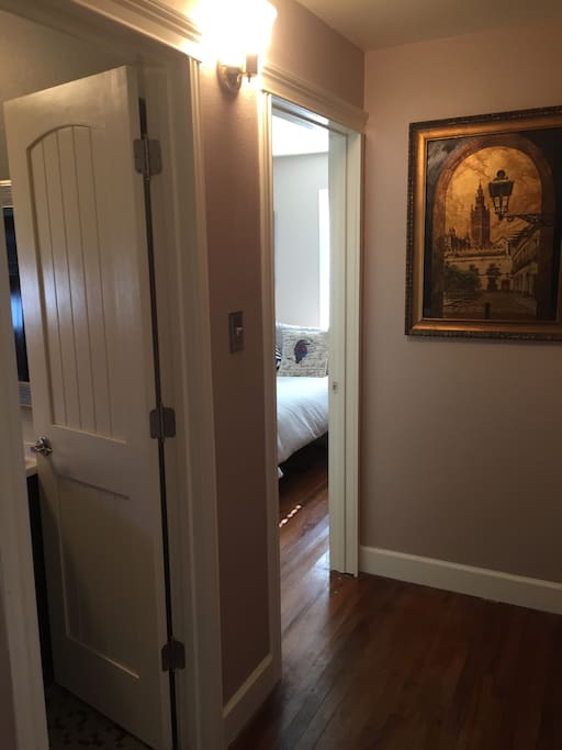Hallway leading to bathroom and bedroom