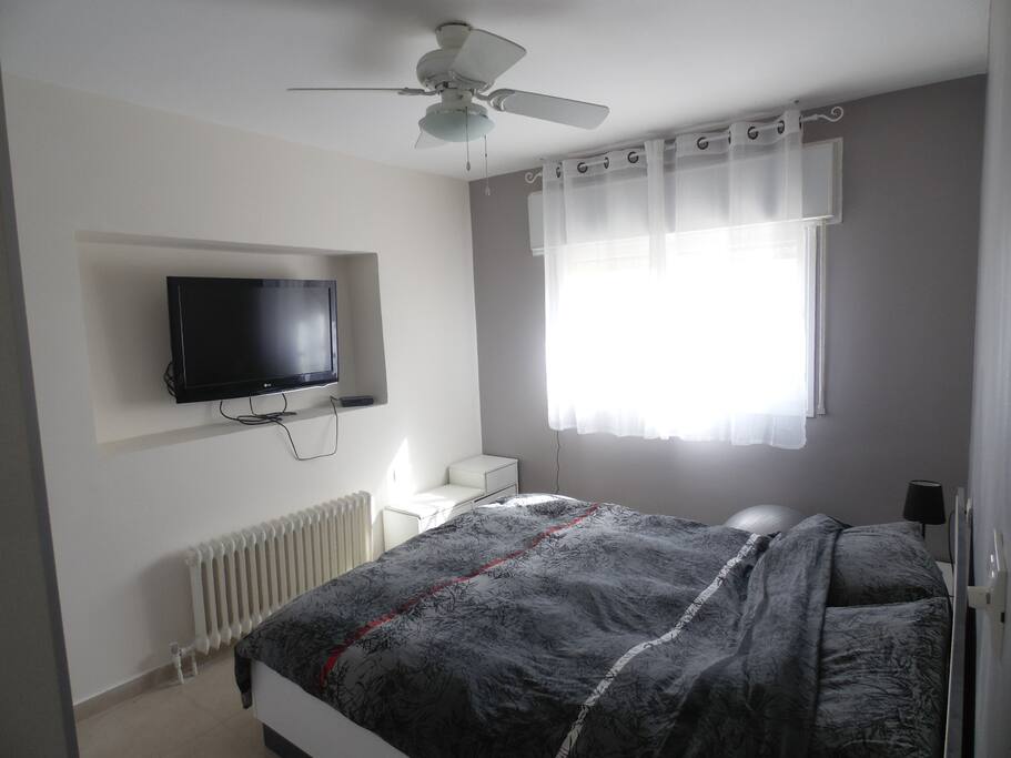 Spacious bedroom with a big and conferrable queen bed
