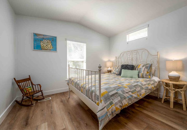 Bedroom #3 with a firm Queen bed, 2 Night Stands, and Closet.