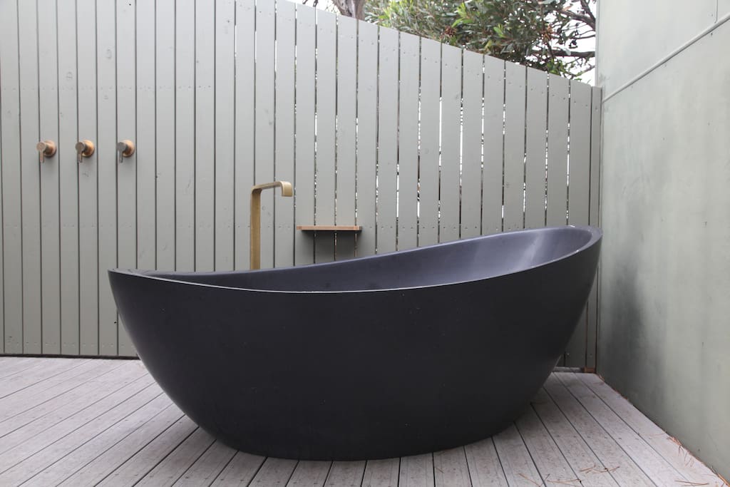 Relax under the stars, in the exclusive stone freestanding bath.