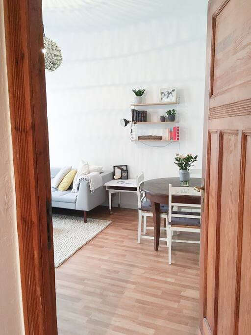 Peek in the living room with round dinner table