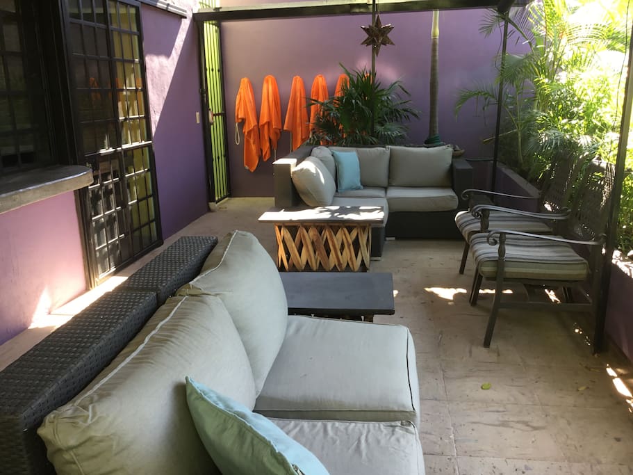 Patio outside blue & green apartments