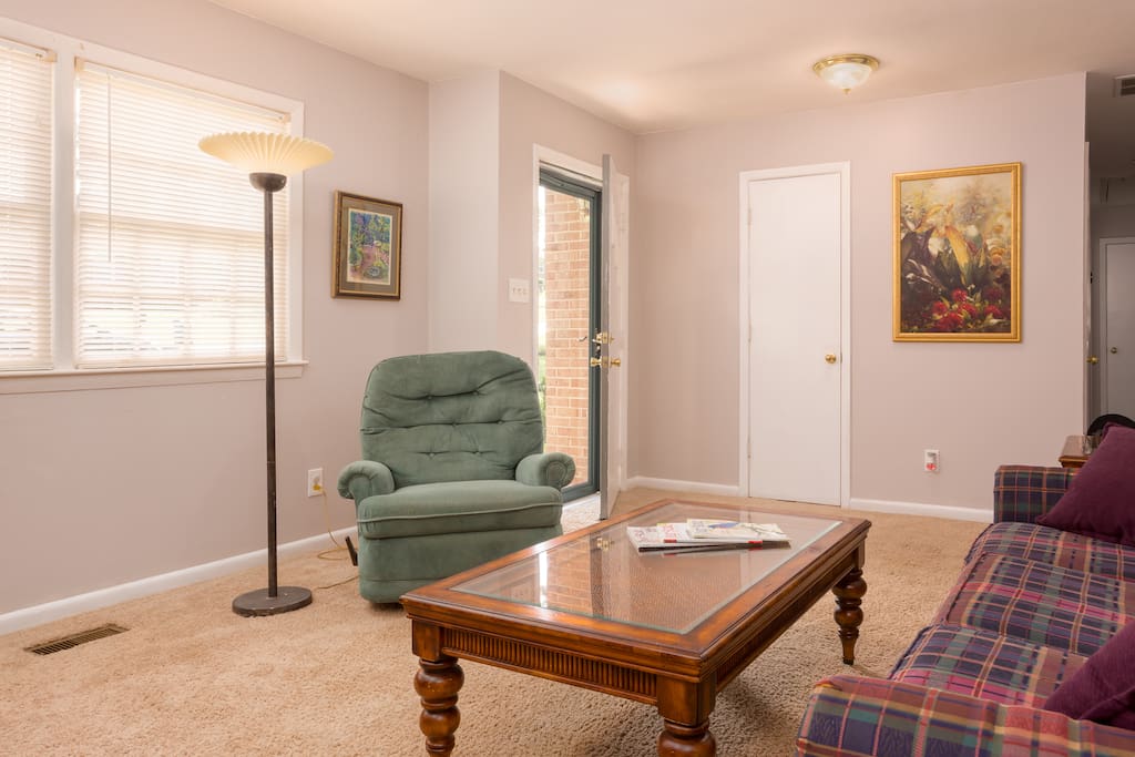 Relax and unwind in the living room. Check out the desk area, perfect for business travelers!