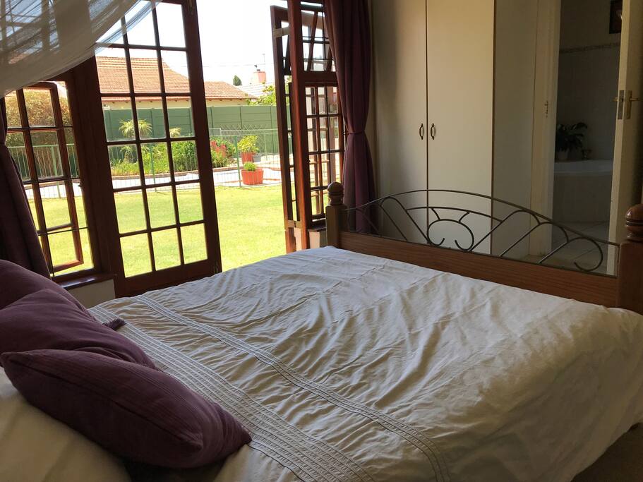 Main bedroom looking on to the back garden and pool