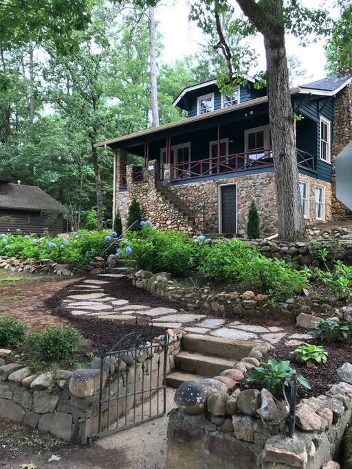 Front exterior of the house. Ground level is used for owner's storage, with only access to main level through front and backdoors. 2 parking spots available behind house.