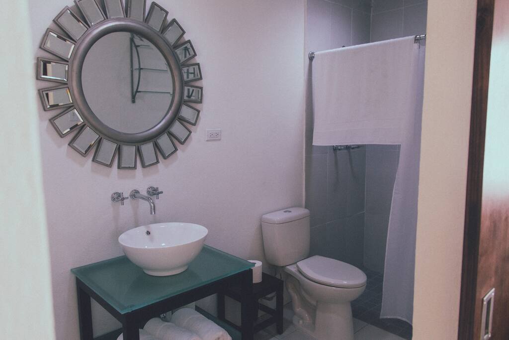 Private bathroom with hot water and towels.