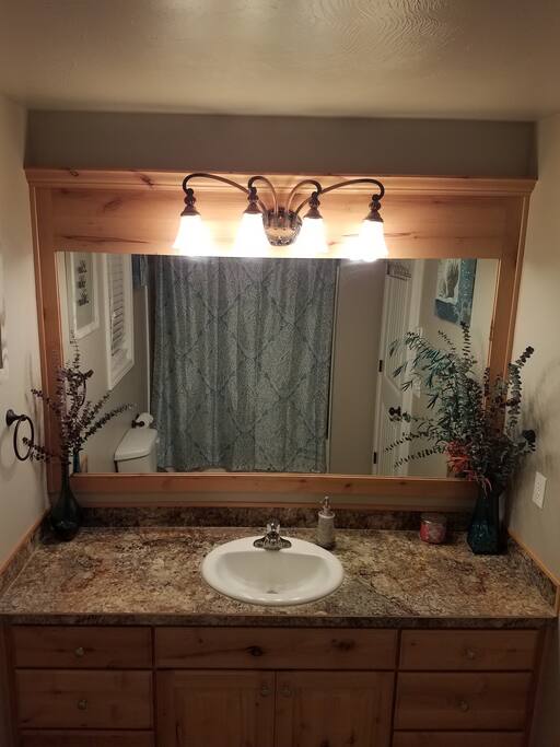 Full upstairs bathroom with shower/ tub and toilet
