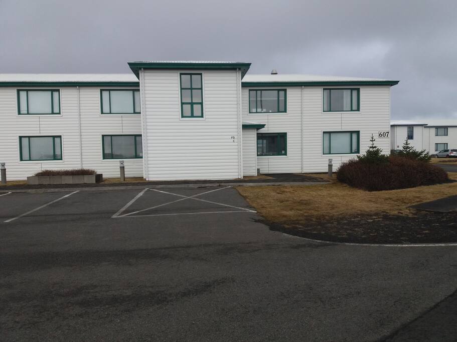 The entrance is on the right side of the house. Apartments F, G and C