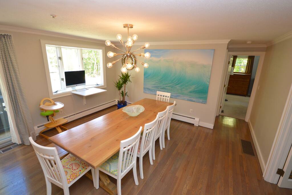 Open dining room with seating for 8 plus seating at the island.