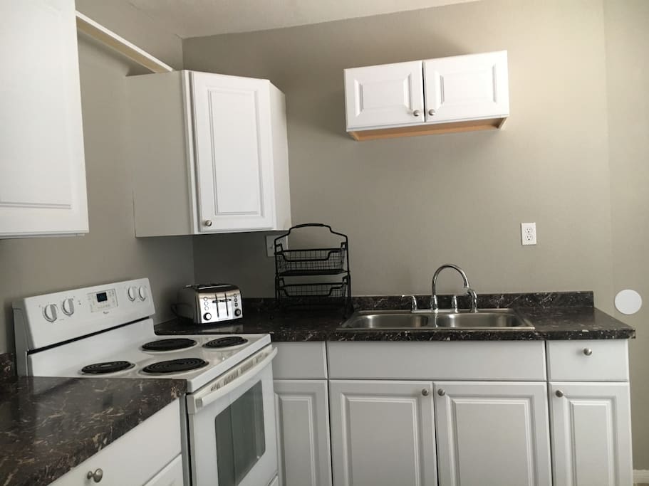 Full size equipped kitchen with refrigerator., we now have microwave, toaster, blender, coffee maker etc.