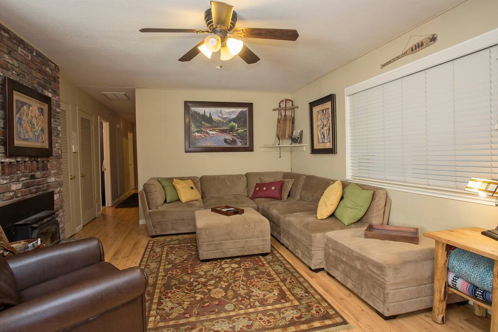 Living room with large sections sofa and TV