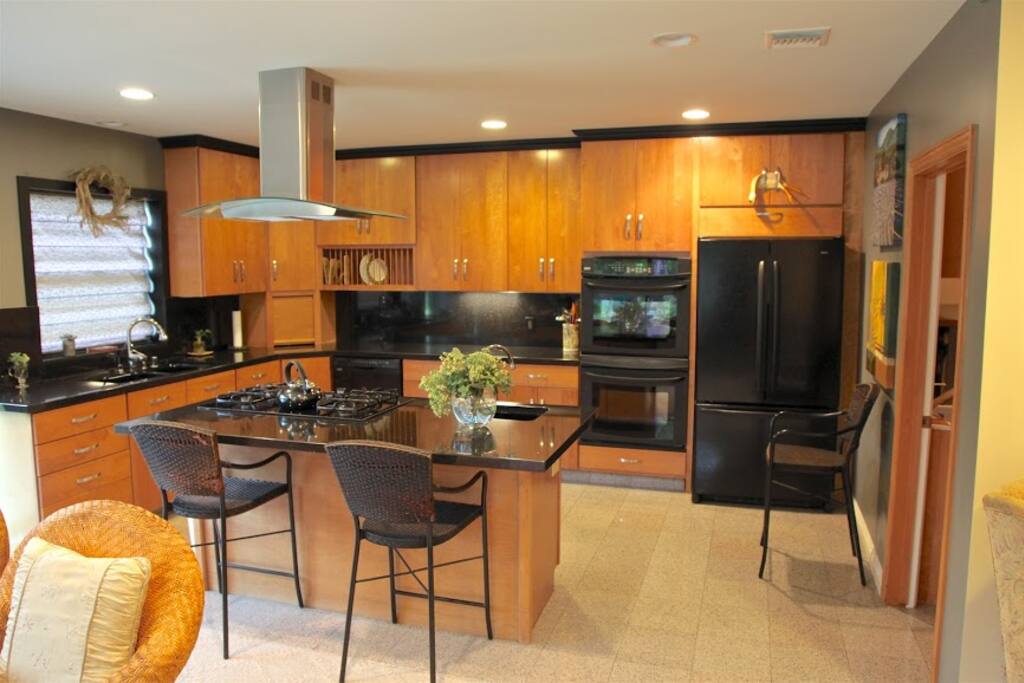 full kitchen with counter bar seating