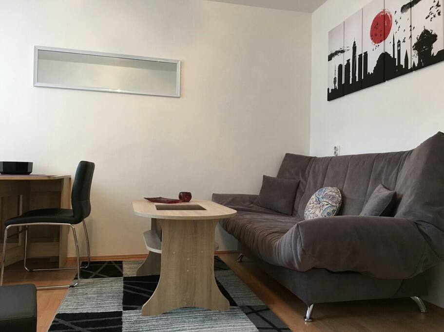 Living room sofa that can be converted into comfortable bed for two.