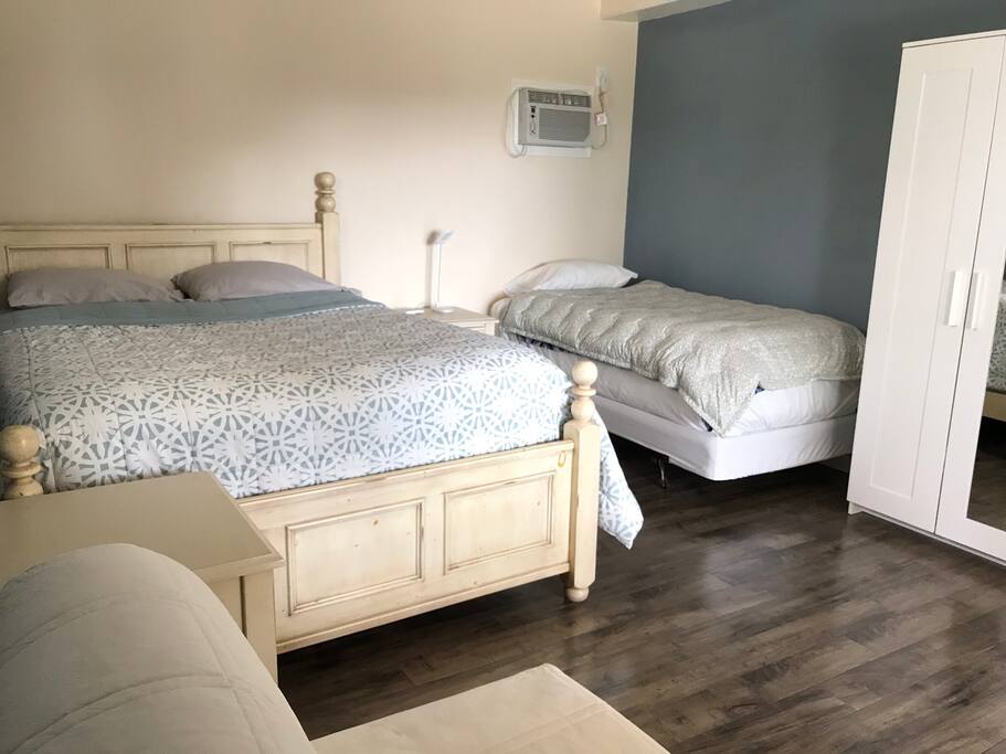 Comfortable, open & spacious room with a queen, a twin & a sofa bed and patio door opens to the private patio.